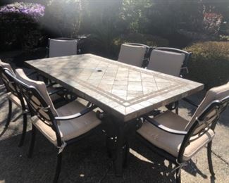 Patio table-metal base with tile top
Including 6 metal chairs
6 ft and 5” long, 42” wide, 29” tall
$750.