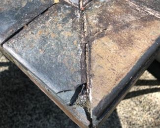 Photo #3 of patio table with the damage to corner.