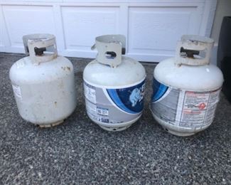 2 empty propane tanks and 1/2 full propane tank. All 3 tanks $30.00