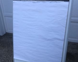 Large artist easel or office easel. There is paper on it now and you can buy a new replacement paper as you use it as folding legs. $32.00