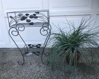 Metal plant stand and one silk grass with pot. $22.00