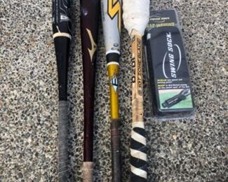 Three aluminum bats and one swing bat and one new swing sock. $35.00