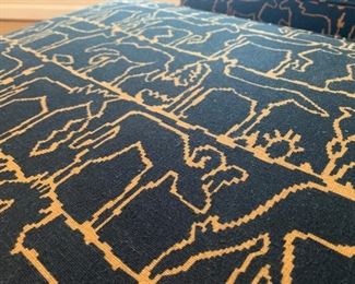 Custom black and gold upholstered lounge chair and ottoman, $450
