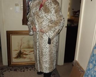 Beautiful faux fur long coat. Still has tags.  $150.00