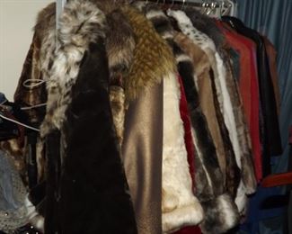 the new coats hanging on rack. Never worn with tags.