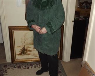 suede coat with fringe on sleeves and around neck. Never worn. $100.00