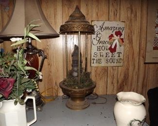 0P.    Vintage rain lamp. The light does work. Have not tested the pump on it.  Has the water mill in center.   $100.00