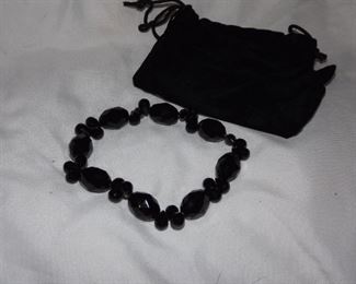 40.  Stretch black beads bracelet. $6.00