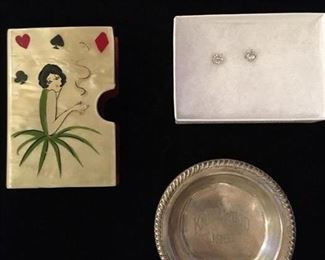 #117 A $12 1920s celluloid cigarette case; B $10 CZ stud earrings; C $12 small sterling trophy dish, 1951