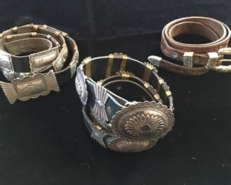 #41 A $250 silver concho belt w/12" rectangular conchos hallmarked VJP, 47"; B $300 silver concho belt with 7 conchos and 8 butterflies, hallmarked WVC ,38"; C $25 ranger set on tooled leather belt