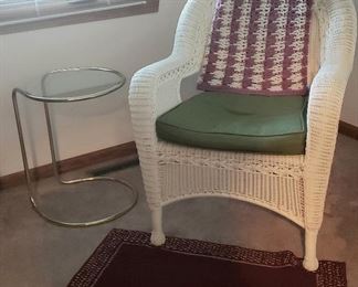Small glass & metal table and the other "wicker" arm chair