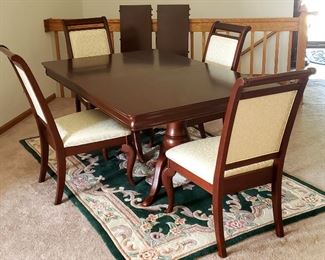 68" x 42" double pedestal dining table has two 14" leaves & four sturdy upholstered side chairs.  Perfect condition