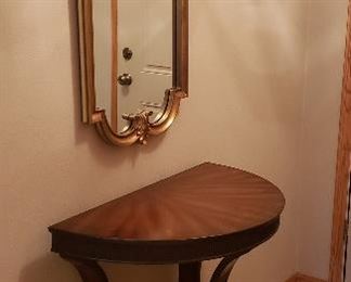 Ornate wall mirror, attractive half round hall table & another throw rug