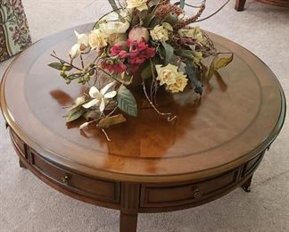 Four drawer round coffee table