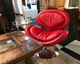 Red Leather Italian Swivel Chair originally $2500 sale price $875. Add a splash of color to your room!