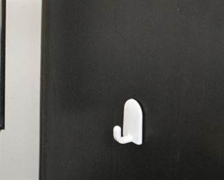 Cabinet has a plastic hook on one side.
