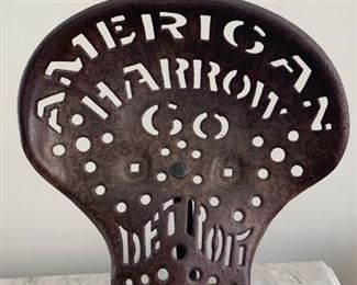 $100 - Antique / Vintage American Harrow Co, Detroit Metal Tractor Seat (mounted on display stand)