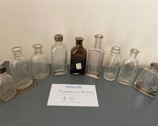 Item #132:   9 Small Old Bottles                                      $15