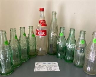 Item #140:   10 Coca Cola Bottles                                    $30