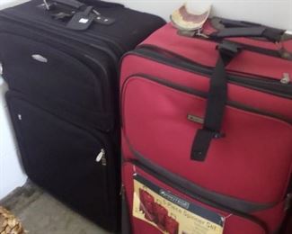Red or black large suitcase $10 each