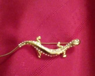 Lizard Pin With Clear Stones Around Edge And Green Stone Eyes Marked With "Ellen Kiam" $12
