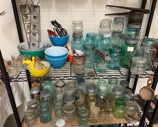Loads of vintage kitchen items including pyrex, blue ball canning jars and more. 