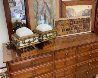 Nice Dresser by Willett and an antique Oliver Tractor sign is on the dresser 