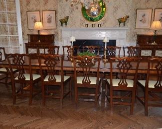 $3,000 Dining Table Mahogany Rosewood 135"W (includes 2 leafs 19 1/2" each) x 5ft D with pads. 12 Chairs covered with leather seats. $5,000