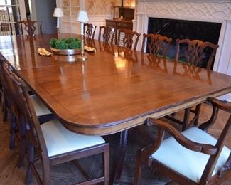 $3,000 Dining Table Mahogany Rosewood 135"W (includes 2 leafs 19 1/2" each) x 5ft D with pads. 12 Chairs covered with leather seats. $5,000