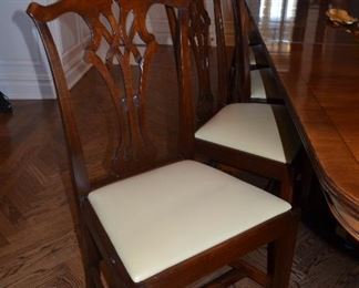 $3,000 Dining Table Mahogany Rosewood 135"W (includes 2 leafs 19 1/2" each) x 5ft D with pads. 12 Chairs covered with leather seats. $5,000