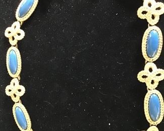 Heavy gold necklace with blue stones $20. 