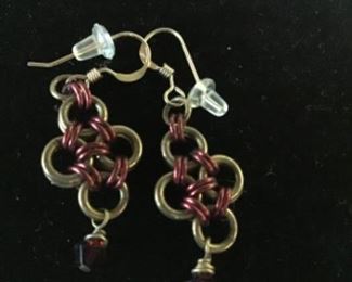 Antique copper wrapped around brass rings with a small ruby colored stone hanging $20. Shipping based on buyers location 