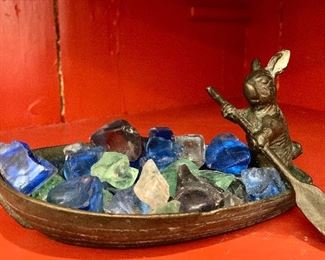 Quite small, heavy metal boat with bunny captain, whisking away his seaglass: $10