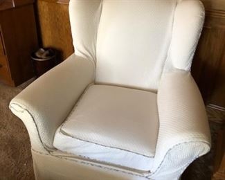 White cloth covered chair.