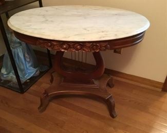 6. Oval coffee table carved apron floral design, marble top    33.5”L x 23.5”D x 17.5”H                 $195
