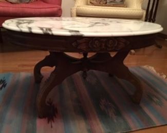 5. Oval coffee table carved apron floral design, marble 
      top    33.5”L x 23.5”D x 17.5”H               $195
	
