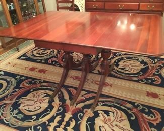 8. Dining room table with 2 extra leaves 		$195
Has one burn mark on top     60.5”L x 41.5”D x 29.5”H 
