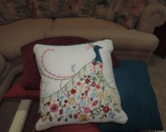 CLOSE UP OF PEACOCK PILLOW