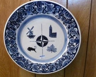Early NATO plate showing symbols of the 4 countries where NATO offices were established -- within handpainted Delft border.
