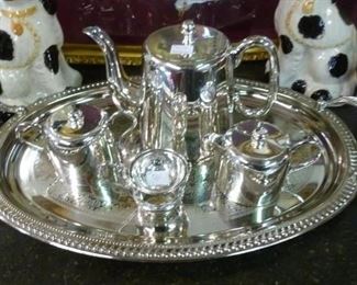 This is a recently polished silverplate tea service, consigned to us by a Scottish lady who thoroughly enjoyed it for decades, priced @ $100 for the four pieces plus handled round serving tray.