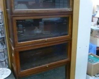 This is one of nine stacking barrister bookcases.  We are offering these at $50 per case (each case with dropfront glazed panel) plus $25 for top and bottom elements.  They are vintage pieces,  sold off originally as government property.