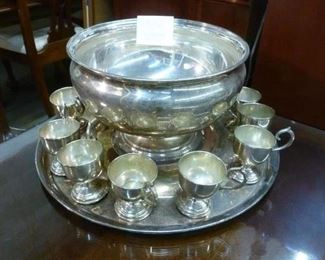 Silverplate punch set consisting of footed bowl, twelve handled cups, round tray, offered at $94 now.  Good condition.