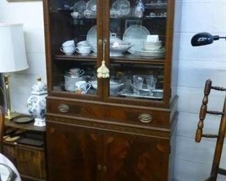 Display cabinet with marquetry banding, one piece.  Interior lights have been added as well as glass shelves.  Wood had been cleaned and oiled with lemon oil.  Originally tagged @ $294, now offered at less than half at $140.