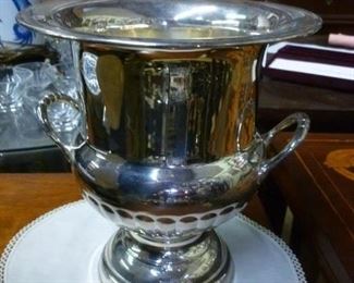 One of 8 silverplated champagne buckets/urns we still have, now offered at $60 each.
