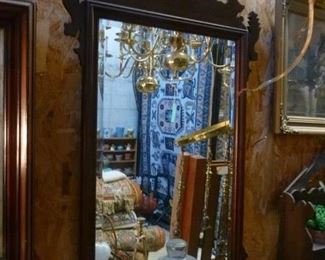 Reproduction Chippendale-style wall mirror in mahogany frame, now offered at $150.