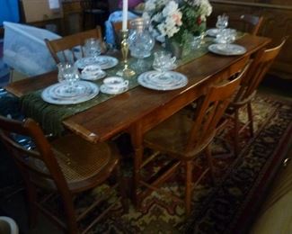 American antique eating table in pine, mated with six assorted side chairs.  Note that table has "breadboard" ends and stretchers.  Originally tagged at $2,400, then reduce to $1,200, now asking $900.