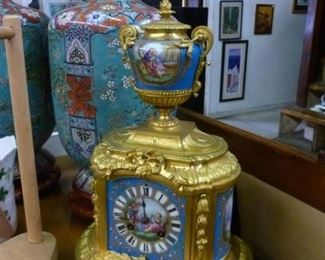Reproduction gilt bronze table clock with dainty chime, the porcelains handpainted, in working condition