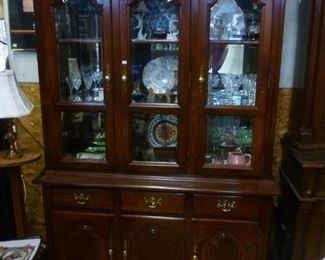 Now reduced to $200 -- lighted, glass shelves, beveled glass panes, in 2 case pieces