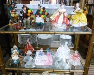 Most of these Royal Doulton figurines we have now reduced to $94-$132 each.  The glass shelf unit that they sit on is offered at $100.