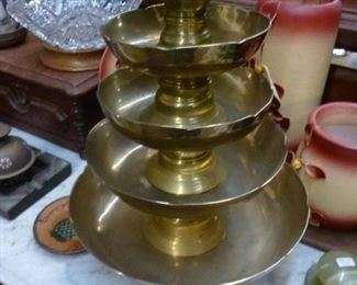 Set of five graduated brass bowls, piled together but can be used separately, @ $90